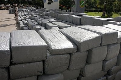 Mexican soldiers guard 12 tons of seized marijuana displayed in Tijuana, Baja California state, Mexico in February 2010. A senior US delegation led by Secretary of State Hillary Clinton on Tuesday pledged to boost joint efforts to tackle surging violence by Mexico's powerful drug cartels.
