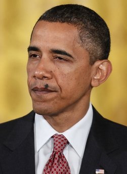 A fly lands on President Barack Obama's face as he delivers remarks on the Affordable Care Act and the New Patients Bill of Rights, Tuesday, June 22, 2010, in the East Room of the White House 
