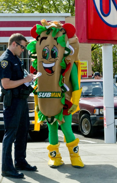 A Driving the submobile way too fast.

B Exposing his fresh greens to passersby

C The cops sub order got screwed up inside and had way too much mayo.

What say you?

