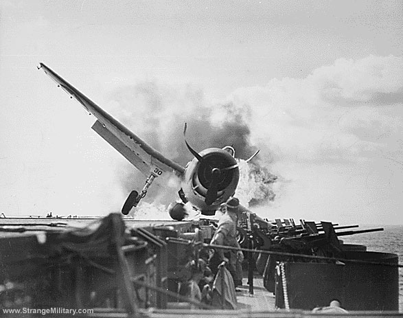 BURNING WWII FIGHTER ON FLATTOP DECK 