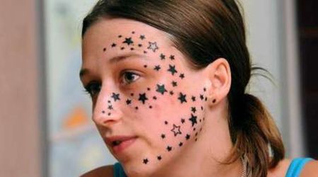 is suing the tattooist for 10,000 Euros damages.

Kimberley Vlaminck, 18, claims tattooist Rouslan Toumaniantz spoke such bad English and French that he misunderstood her at the Tattoo Boy studio in Courtrai, Belgium.

She said the translation error left her scarred for life after he tattooed her with an incredible 56 stars.
