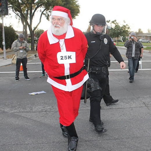 Ontario, California. November 29, 2013. Karl Hilgert, was taking part in a protest at WalMart were protesters were demanding the retail giant (who employs over 1% of the working population of the country) bring their pay up to a living wage. Hilgert was hauled off by police, during a scuffle outside of the store.