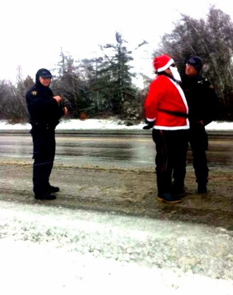New Brunswick, Canada, 2013. Jean Sock is arrested by the RCPM (Royal Canadian Mounted Police,) along Hwy 11 at Elsipogtog Fracking protest.