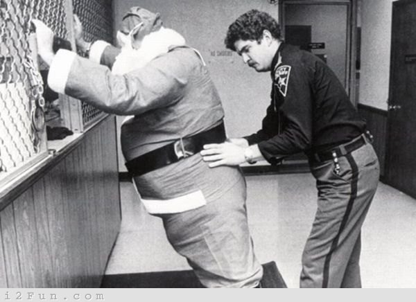 Akron, Ohio 1978. John Kaufman, 30, after he was arrested for allegedly assaulting a jeweler who objected to his method of soliciting contributions. Kaufman, who was booked on assault charges, was in charge of a group of three Santas from the Cleveland Temple of Hare Krishna who were soliciting contributions in an aggressive manner, according to police reports.