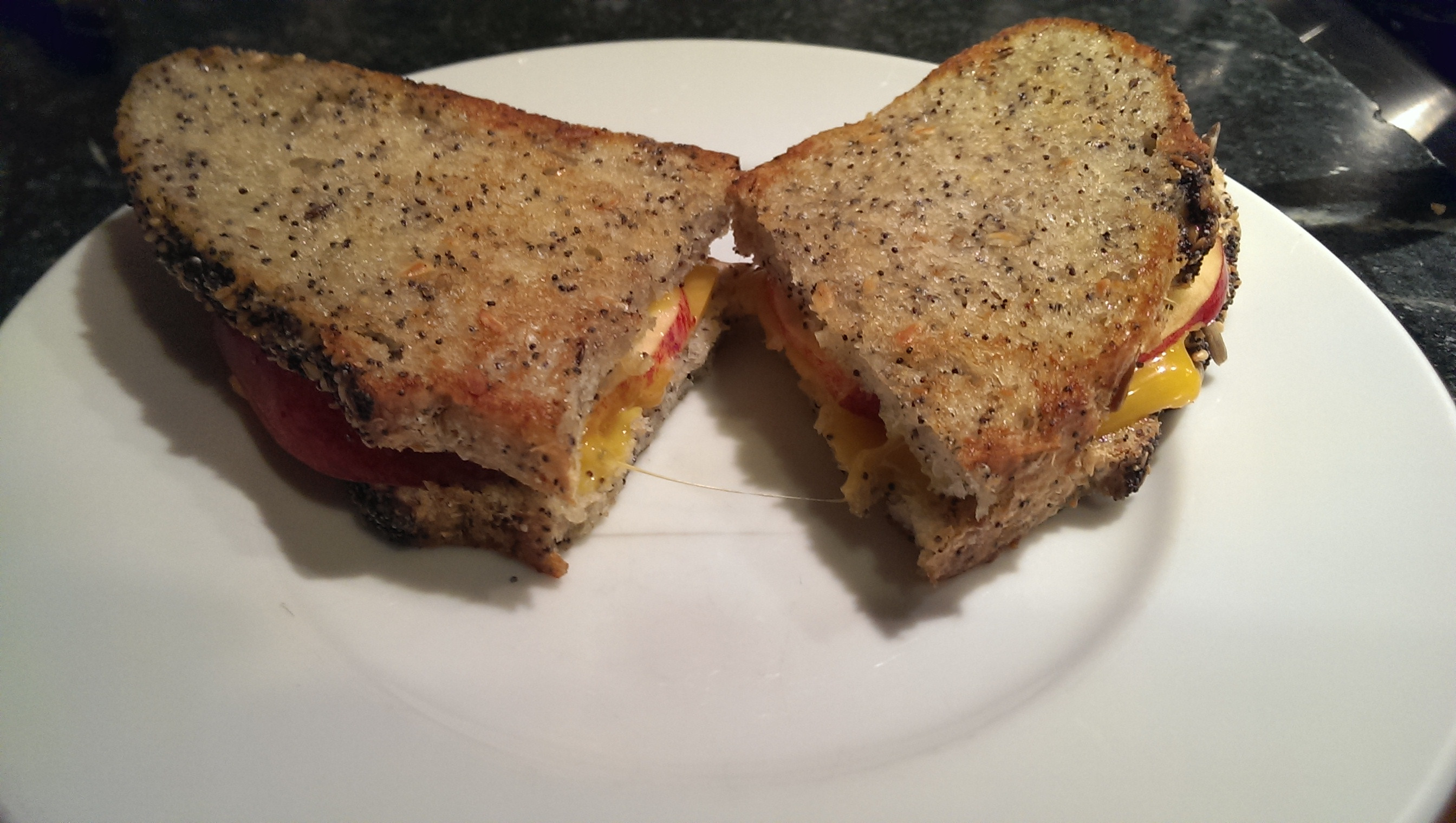 Aged cheddar with apple on poppy seed bread