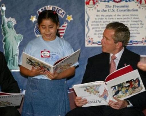 Gearge W. Bush Reads Book Upside-Down. Bush and a young child are both   reading from America: A Patriotic Primer by Lynne Cheney. But if you look   closely, it appears that President Bush is holding his book upside down.