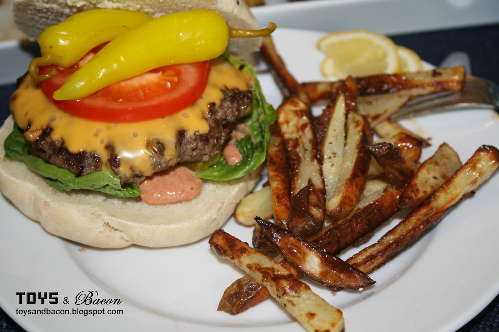 Cheeseburger with Banana Peppers and special sauce, with salt and peppered  fries.