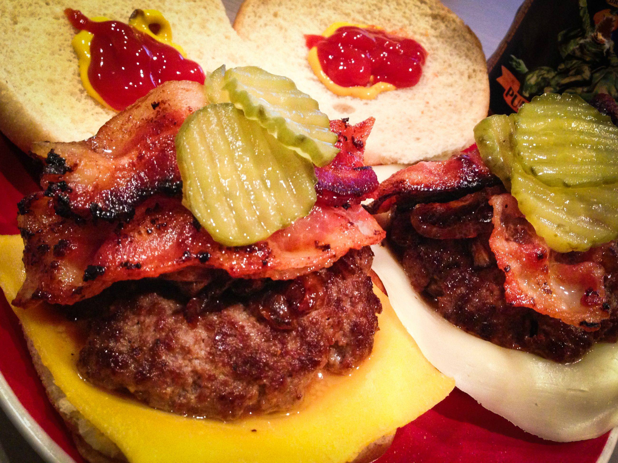 Mini Cheeseburgers, 1 American, 1 Provolone, with caramelized onions, maple bacon and pickles.