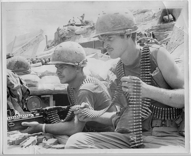 A 20-year-old Stephen Manthei, right, and fellow soldier Bob Tarbuck, left, prepare for the Battle of Ripcord, during which their platoon was attacked, killing everyone but the two of them.