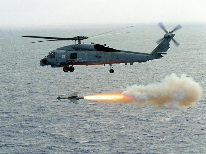 An SH-60 firing an Air-To-Ground missile.