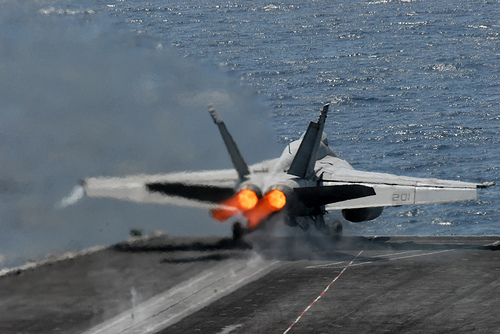 Another F/A-18 Hornet at full thrust.