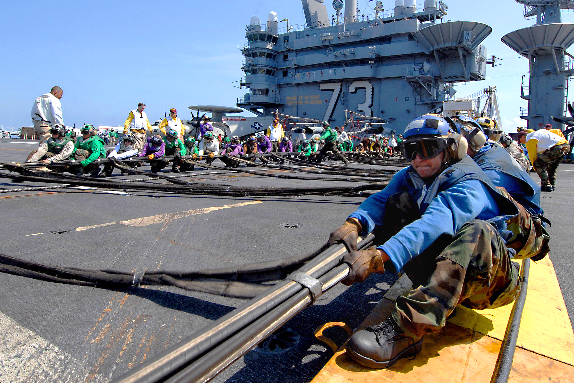 Flight deck personnel from all divisions erect the 'Barricade.' A large net, designed to catch distressed aircraft.