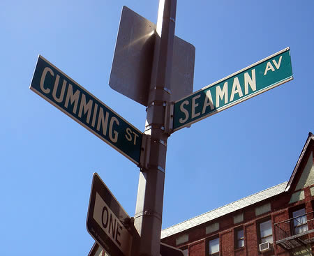 One of the most photographed street signs in Manhattan, NY, USA: the pround intersection of Seaman Av and Cumming St. 