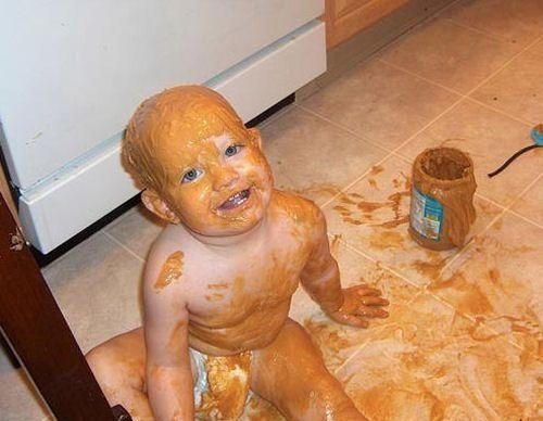Kid gets into a jar of peanut butter