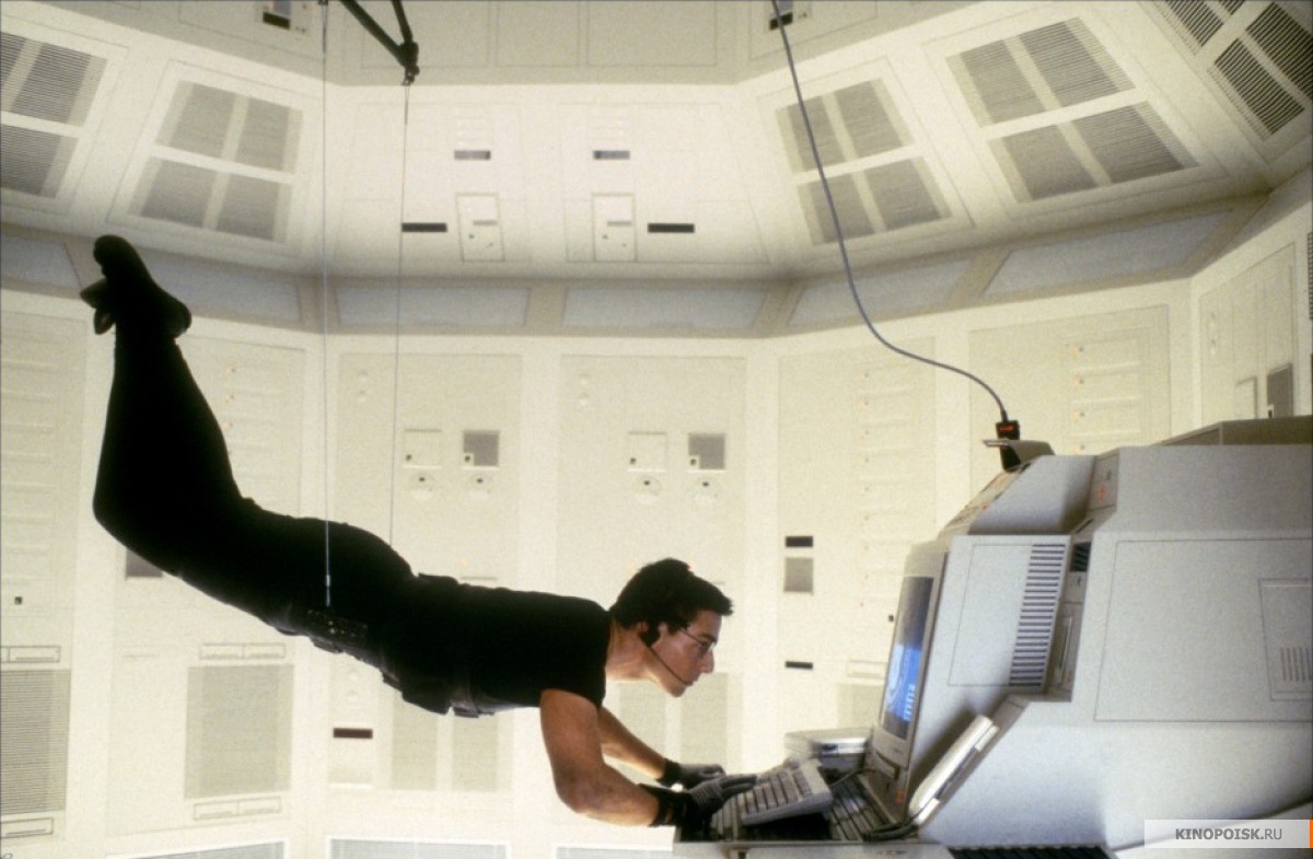 Mission Impossible:
In the computer room scene, when the man enters the room with Ethan suspended above 

him, you can clearly see the room reflected off the floor, as well as the man who 

enters the room; The man was looking at the floor when he entered the room and should 

have noticed Ethan.