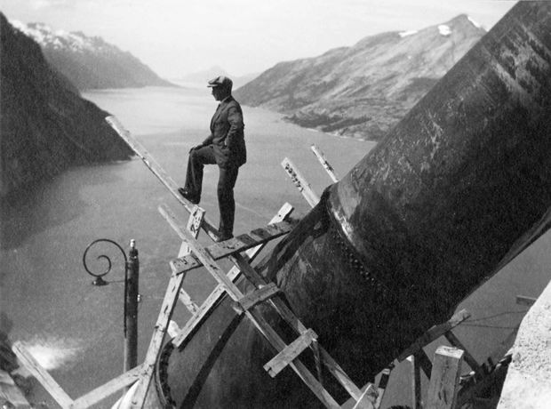 Man standing on a power plant in Norway, 1920.