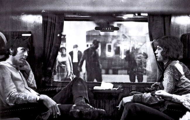 Paul McCartney and Mick Jagger on a train to Bangor (1967)