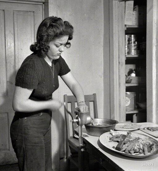 Woman mincing her own fingers during the great sausage shortage of 1955.