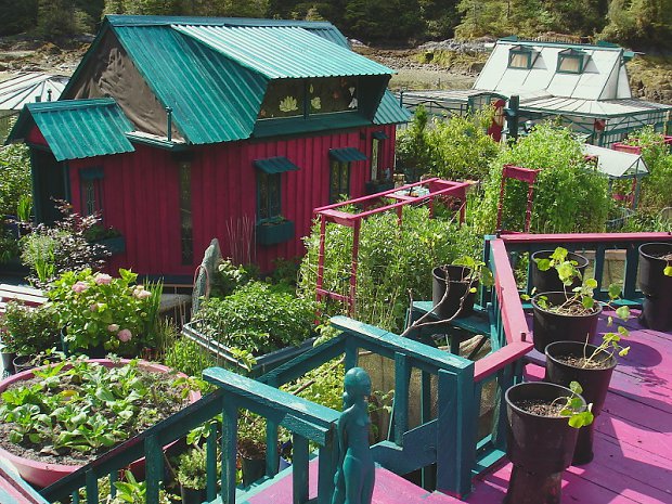 The island features greenhouses, an art gallery and a lighthouse tower, all of which are fashioned from recycled materials and painted bright shades of pinks and purples. The couple grows their own food on the expansive gardens that weave through the property and harnesses the Sun's energy from an array of solar panels.