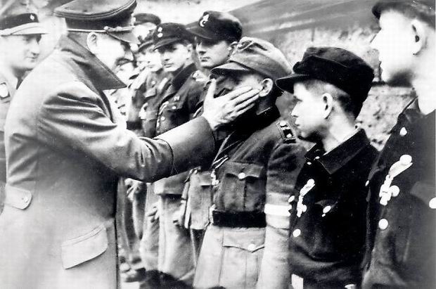 Adolf Hitler slapping a young boy for "not being aryan enough", 1945.
