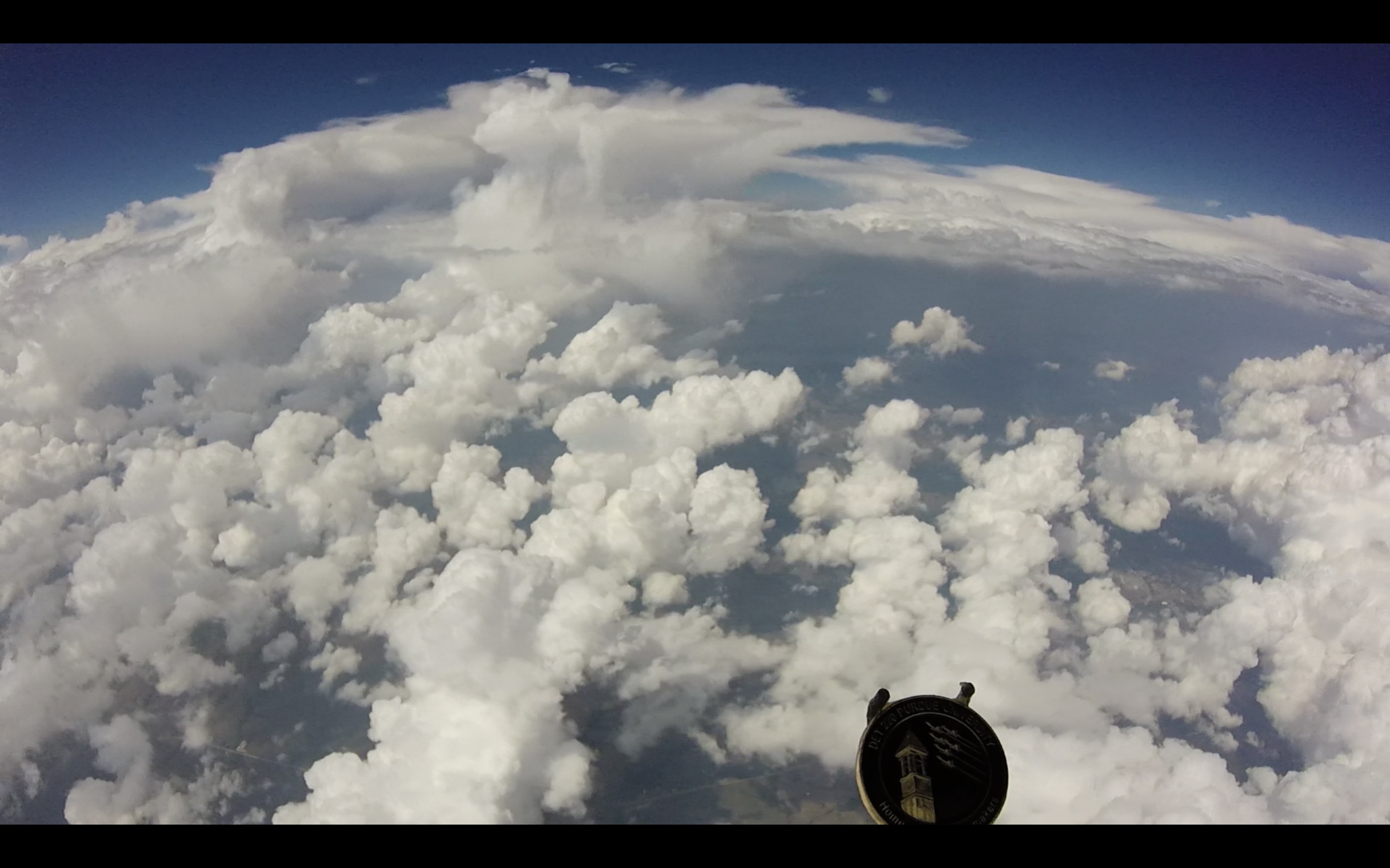 Leaving the clouds below.