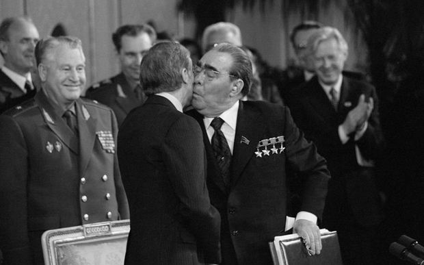 Jimmy Carter and Leonid Brezhnev awkwardly kissing while playing "spin the bottle", 1979.