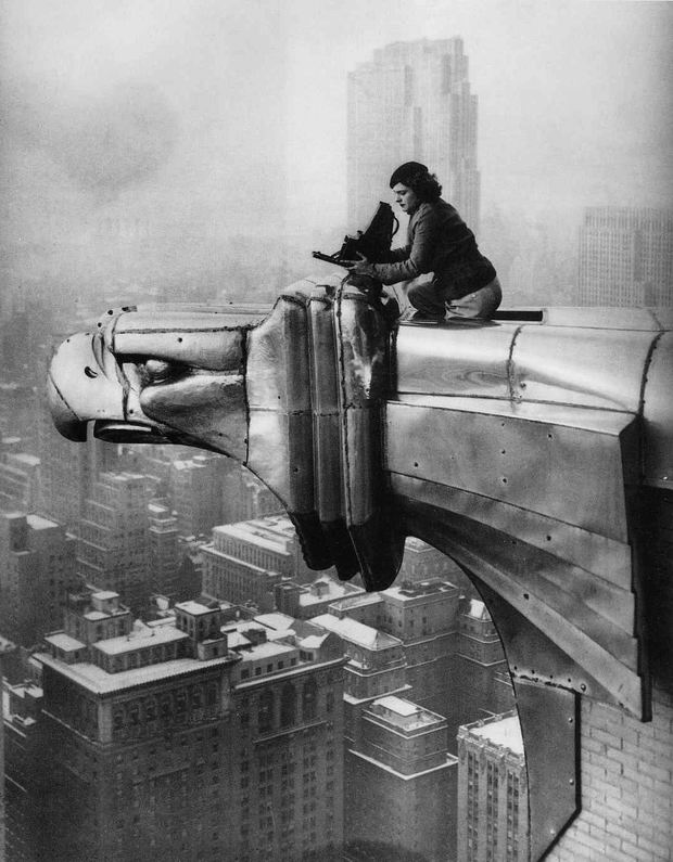 Rare picture of a woman climbing the Chrysler Building to throw down heavy objects on unsuspecting pedestrians, 1934.