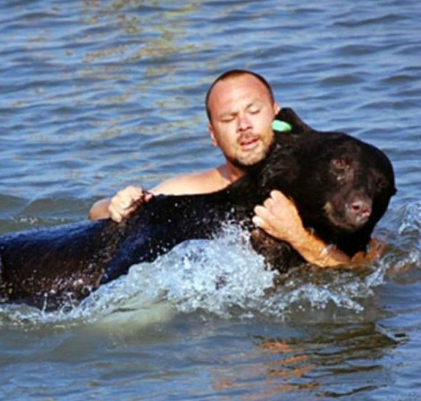 Adam was able to drag the massive bear 23 meters from where it was in the water to the safety of shore.