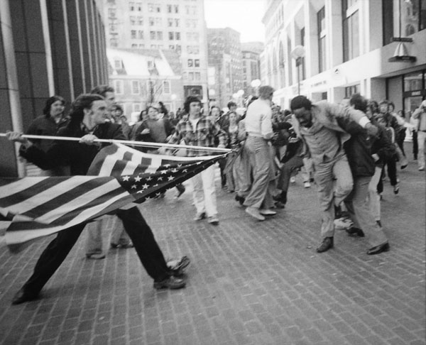 Teenager attacking civil rights activists with a flagpole.