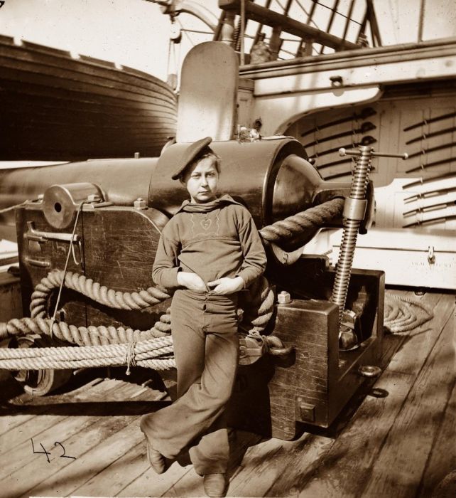 The "powder monkey" on the USS New Hampshire in 1864. The powder monkey ran gunpowder from the powder room to the ships cannons and were usually boys aged 12-14, selected for their height as they could easily duck for cover.