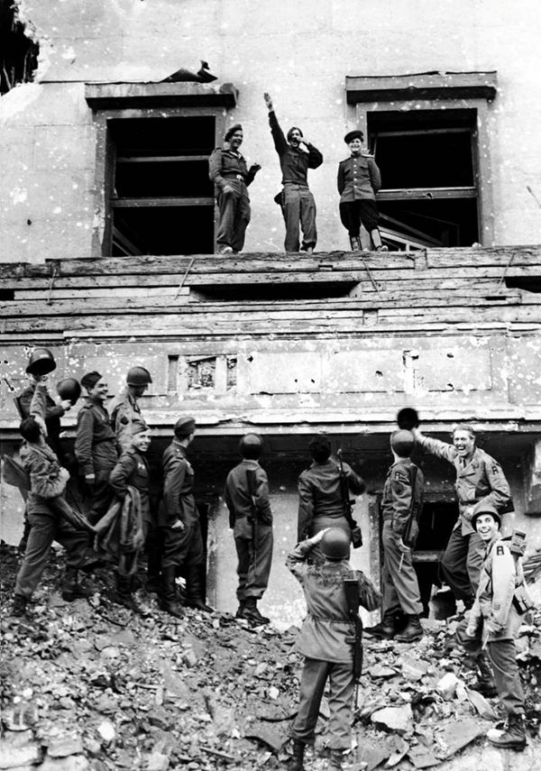 Allied forces mocking Hitler atop his balcony at the Reich chancellery.