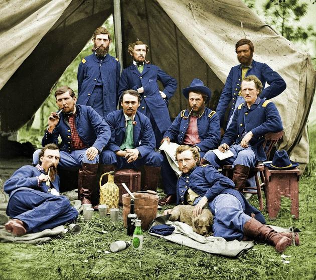 Colored photo of General Custer and his men during the Civil War.