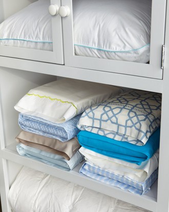 Use a pillowcase from a sheet set to keep the rest of the sheets in.