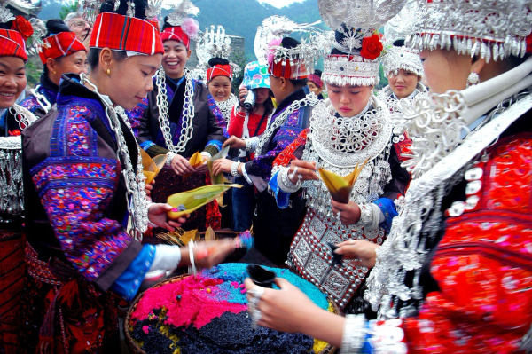 During the Sisters’ Meal Festival in Southwest China, which is their version of Valentine’s Day, the girls dress ornately and cook sticky rice in 4 different colors. The colors represent the 4 main seasons of the year, and the give the rice rolled in a handkerchief to suitors who have serenaded them. The man sifts through the rice, and if he finds 2 red chopsticks, it means the girl likes him back. Only one chopstick means he has been politely turned down. A garlic or chili means the girl was kind of rude about her rejection, and a girl who hasn’t made up her mind will put in a pine needle.
