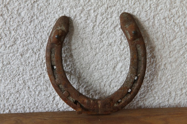 Horse Shoe. You heard about that it brings luck, but do you know which side to hang it. Some say it should be like on the picture to keep fortune in, while others hang it the other way around to trap bad misfortune in it, and some claim it must form a letter "C".