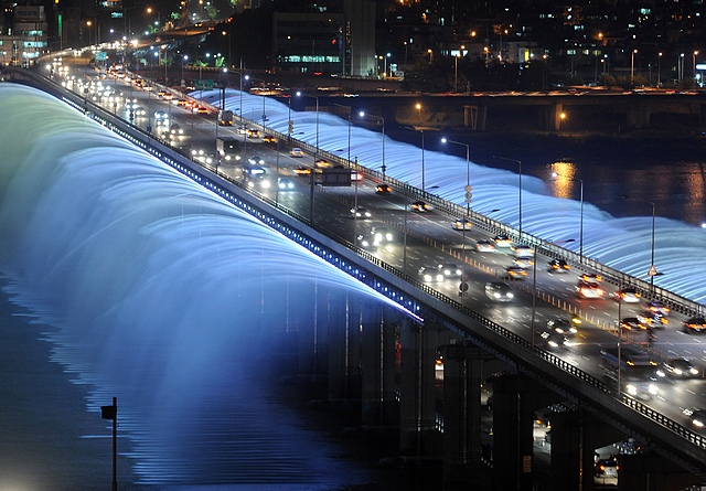 This is the Banpo Bridge in South Korea. To show South Korea is awesome they made a fountain in it. It shoots 190 tons of water a minute and has 10 thousand led lights to make a color show.