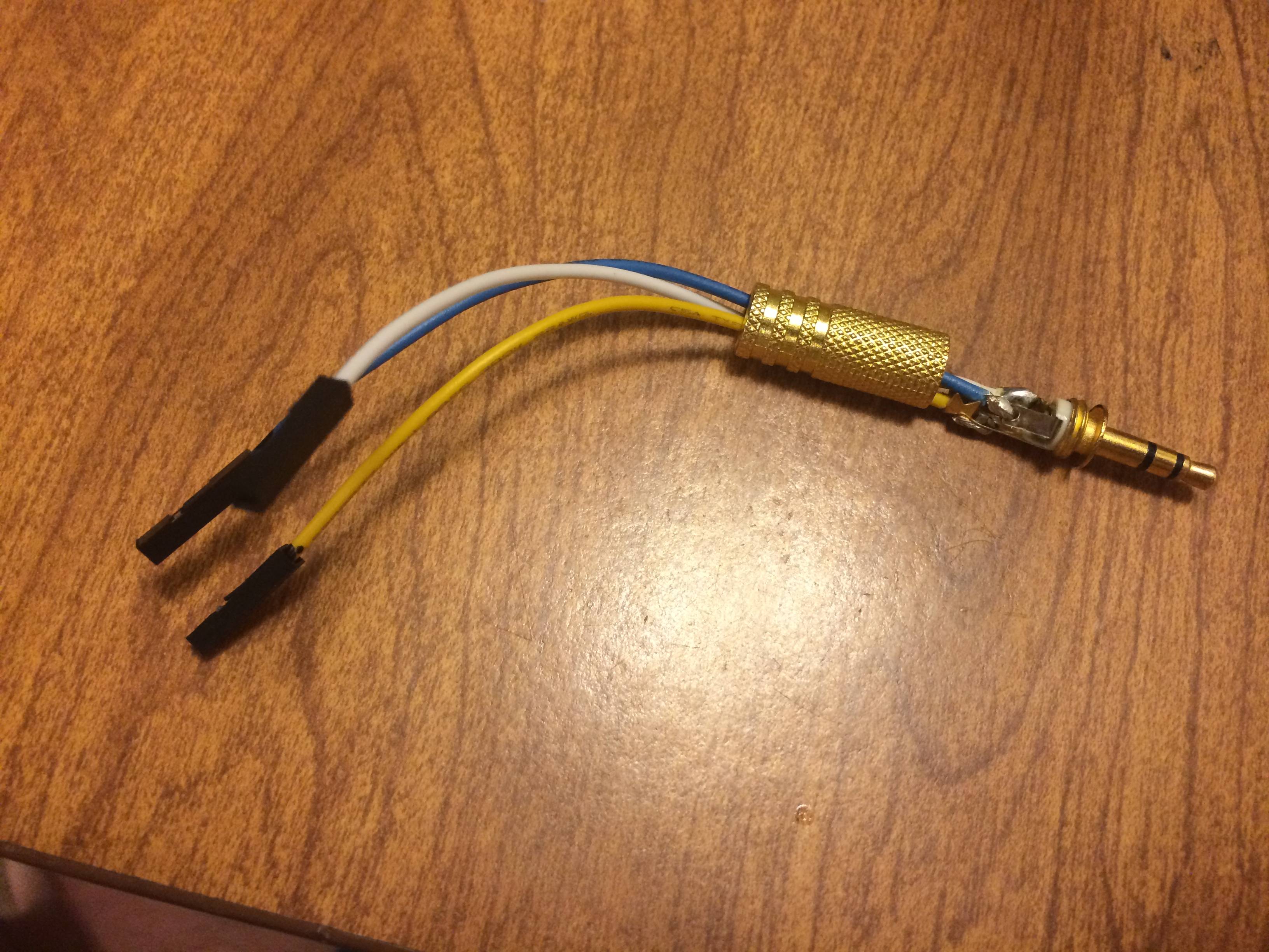 The cutest little audio cable you ever did see! Left it open so you could see how I soldered this. Also ended up fixing an old pair of headphones once I realized you can replace the 3.5mm part.