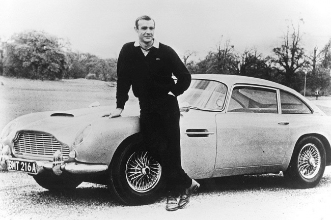 Sean Connery poses with James Bond’s Aston Martin DB5, 1965.