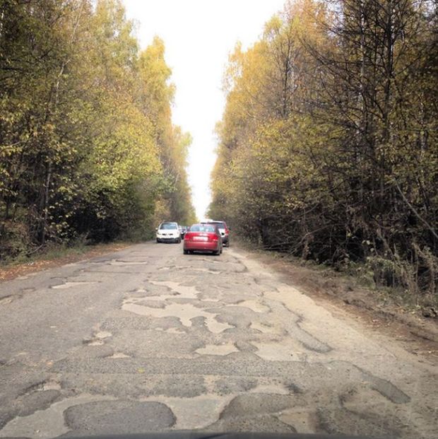 In Post-soviet Russia roads make holes in you.