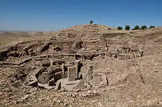 Gobekli Tepe. This site, which was found atop a mountain ridge in Turkey, did a lot to further our understanding of development of ancient customs. The temple was built before the city around it, show just how highly valued religion was to those who settled.