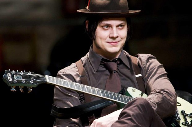 Jack White. He did not broke his leg, he "just" sprained his ankle, what was unusual he used turned it into a show by playing on his back.