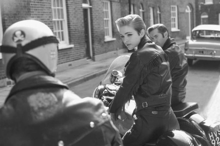 A female motorcyclist in the 60s.