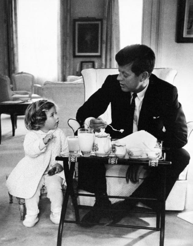 John F. Kennedy has a tea party with his daughter, Caroline.