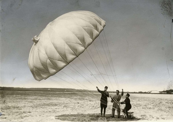 Prototype of parachute being tested out on ground, 1927. After the test they decided that they'll attach it to torso rather than the legs, like on the picture.