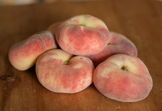 You see the peach on the picture? There's nothing wrong with it, it's a kind of peach that isn't round but resembles more a bun. These peaches get highly popular nowadays. And you know what is the strangest? They are not human made but nature born about two hundred years ago in China.