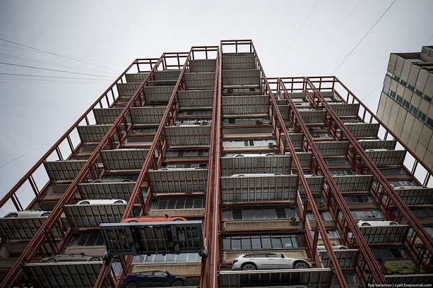 This is not a joke. It is a construction based on Japanese ideas. The car sits outside the owners window, even on the seventh floor, and can be easily called down to the ground cause the mechanism is hidden underground.  What do you think, is this the future of parking?