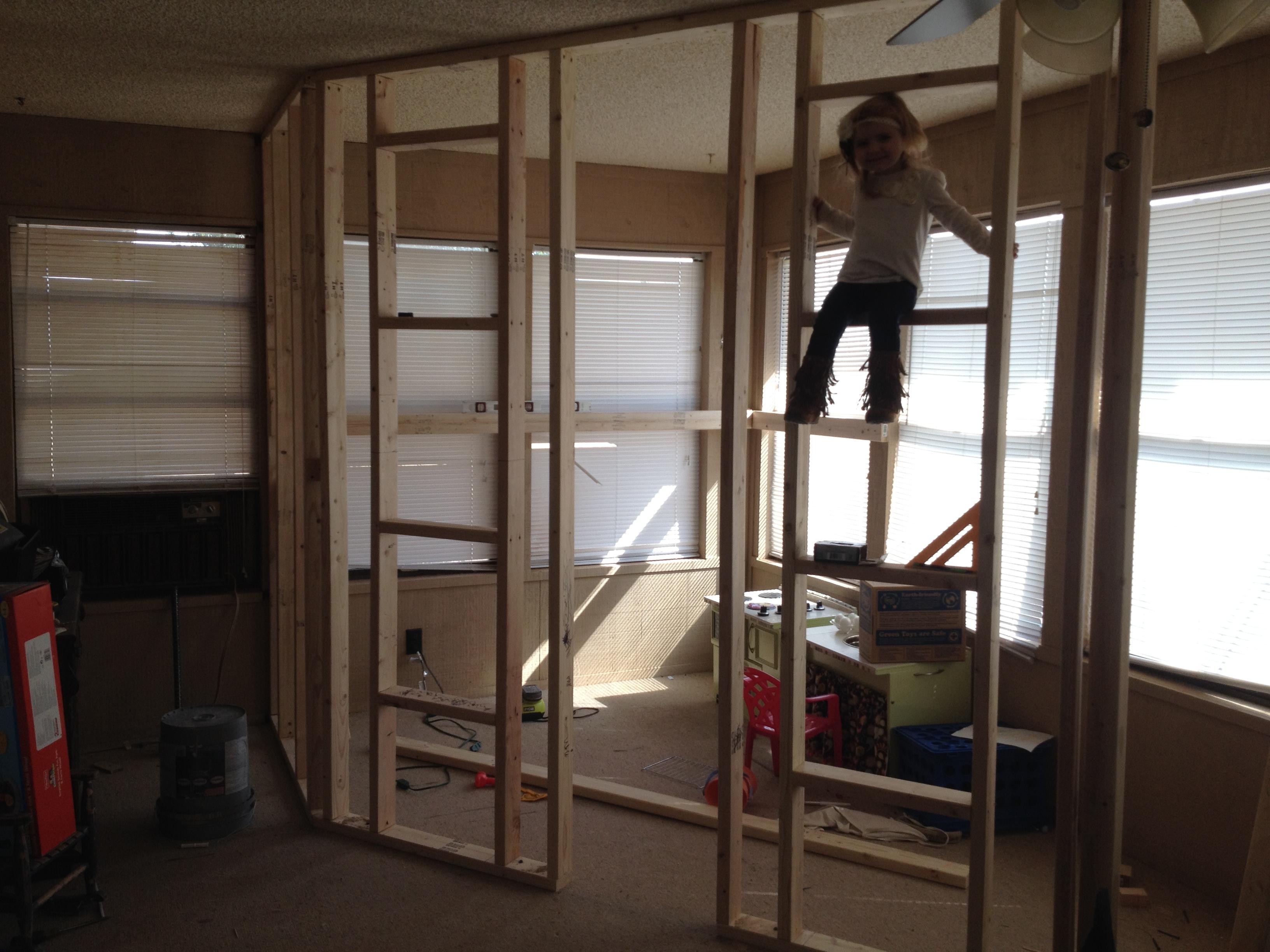 A Father Builds His Kids An Indoor Playhouse With Rope Bridge And A Slide