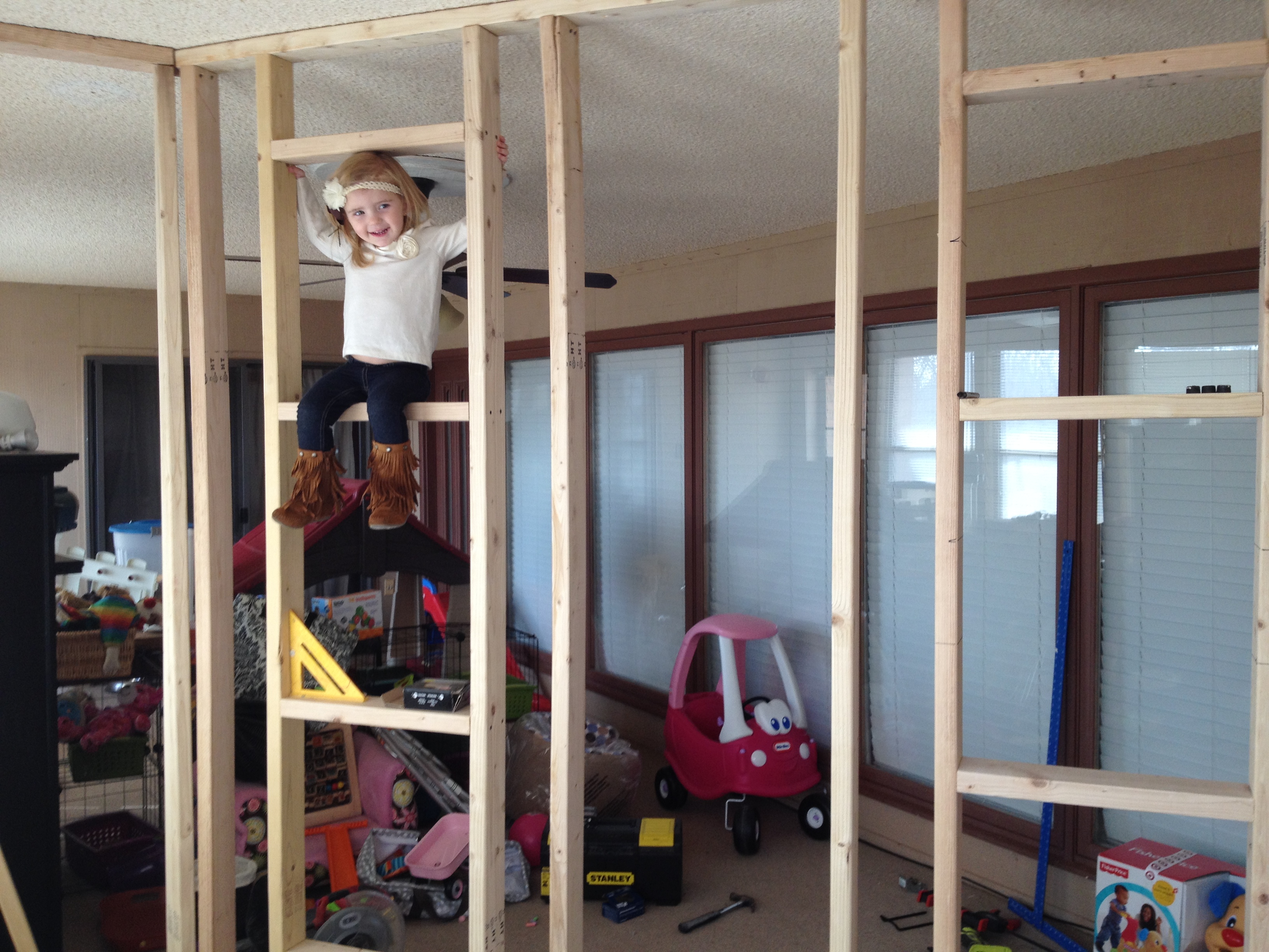 A Father Builds His Kids An Indoor Playhouse With Rope Bridge And A Slide