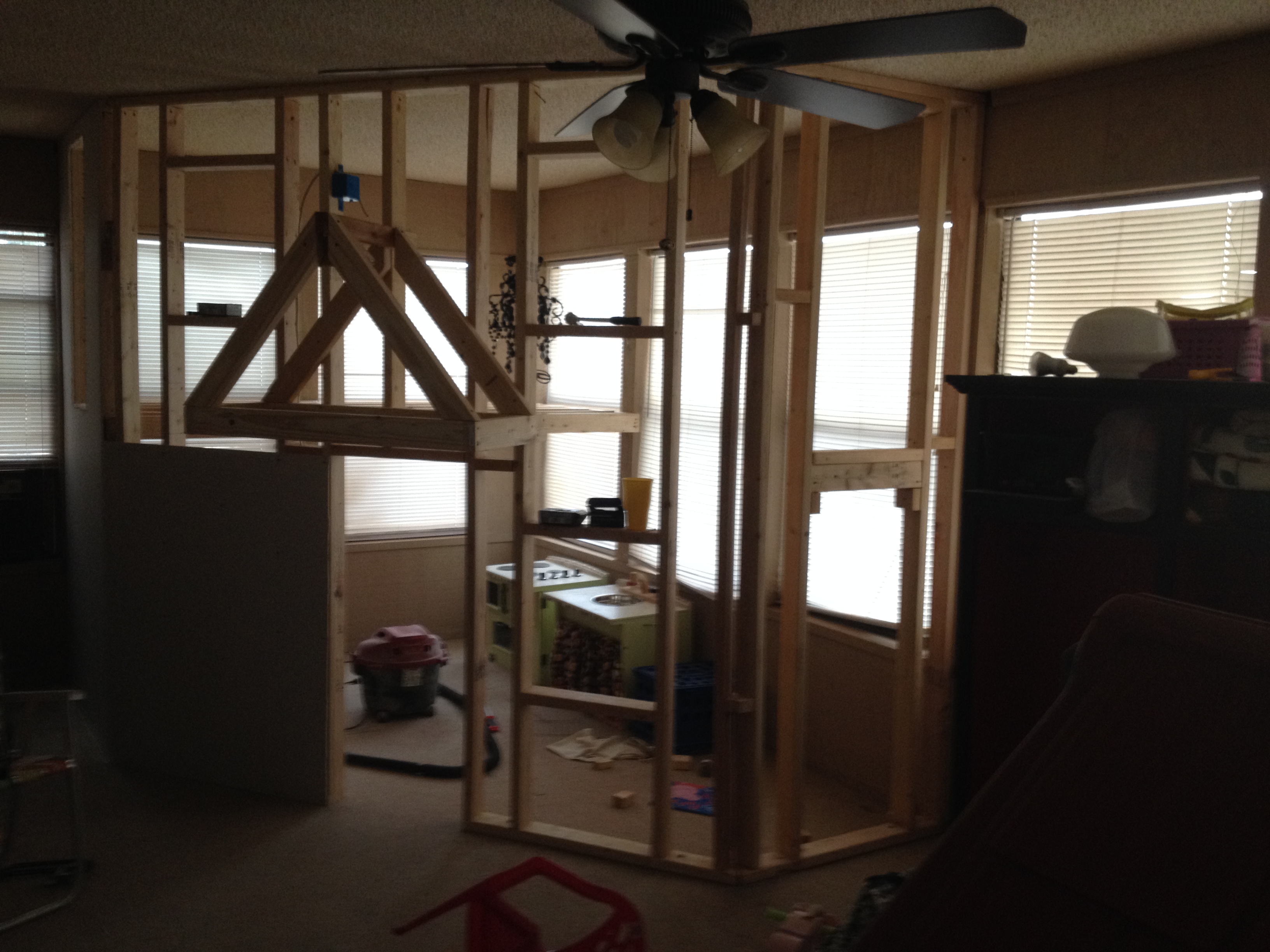 A Father Builds His Kids An Indoor Playhouse With Rope Bridge And A Slide