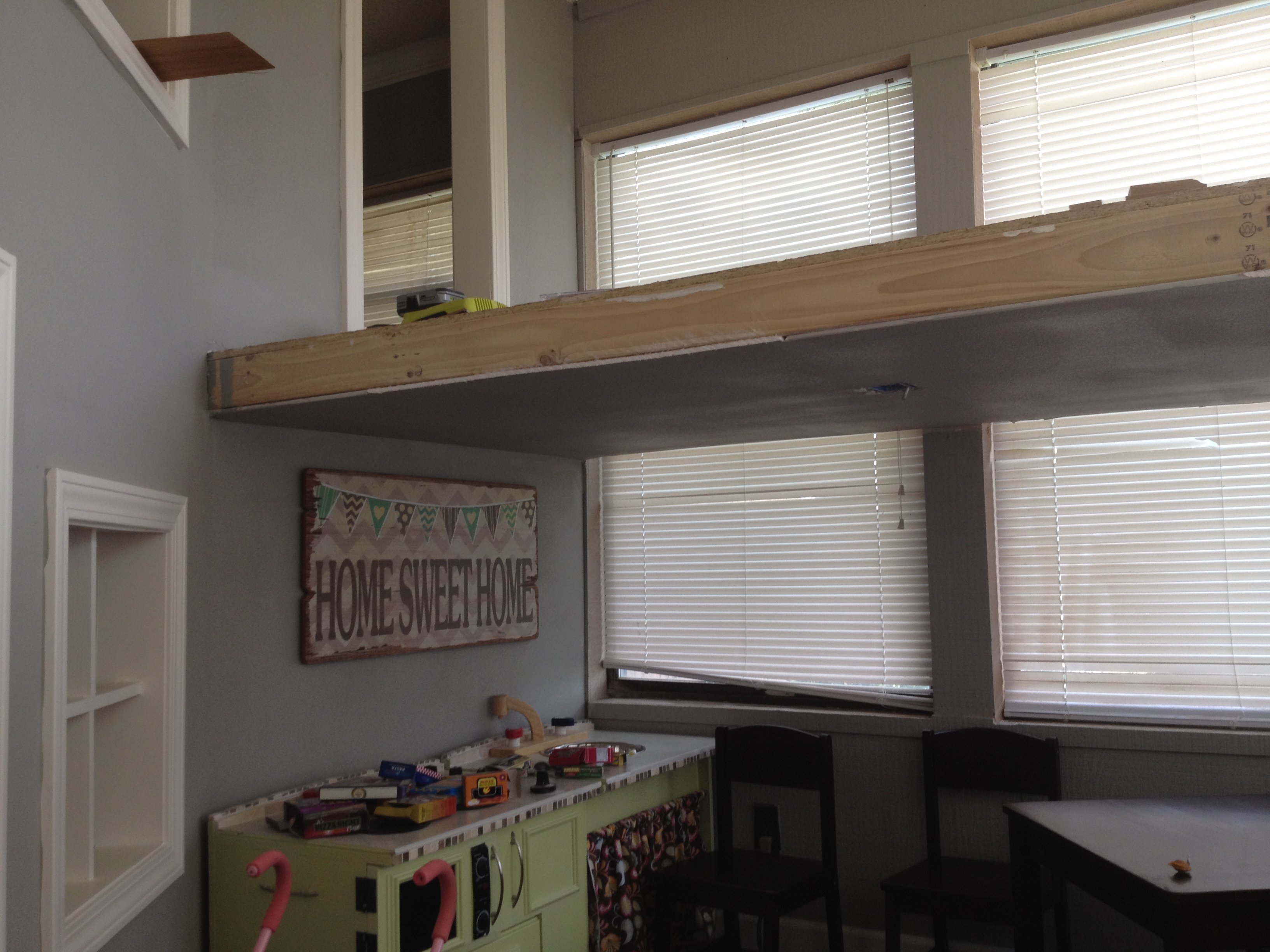 A Father Builds His Kids An Indoor Playhouse With Rope Bridge And A Slide